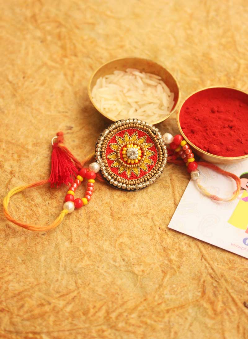 red and yellow mandala rakhi